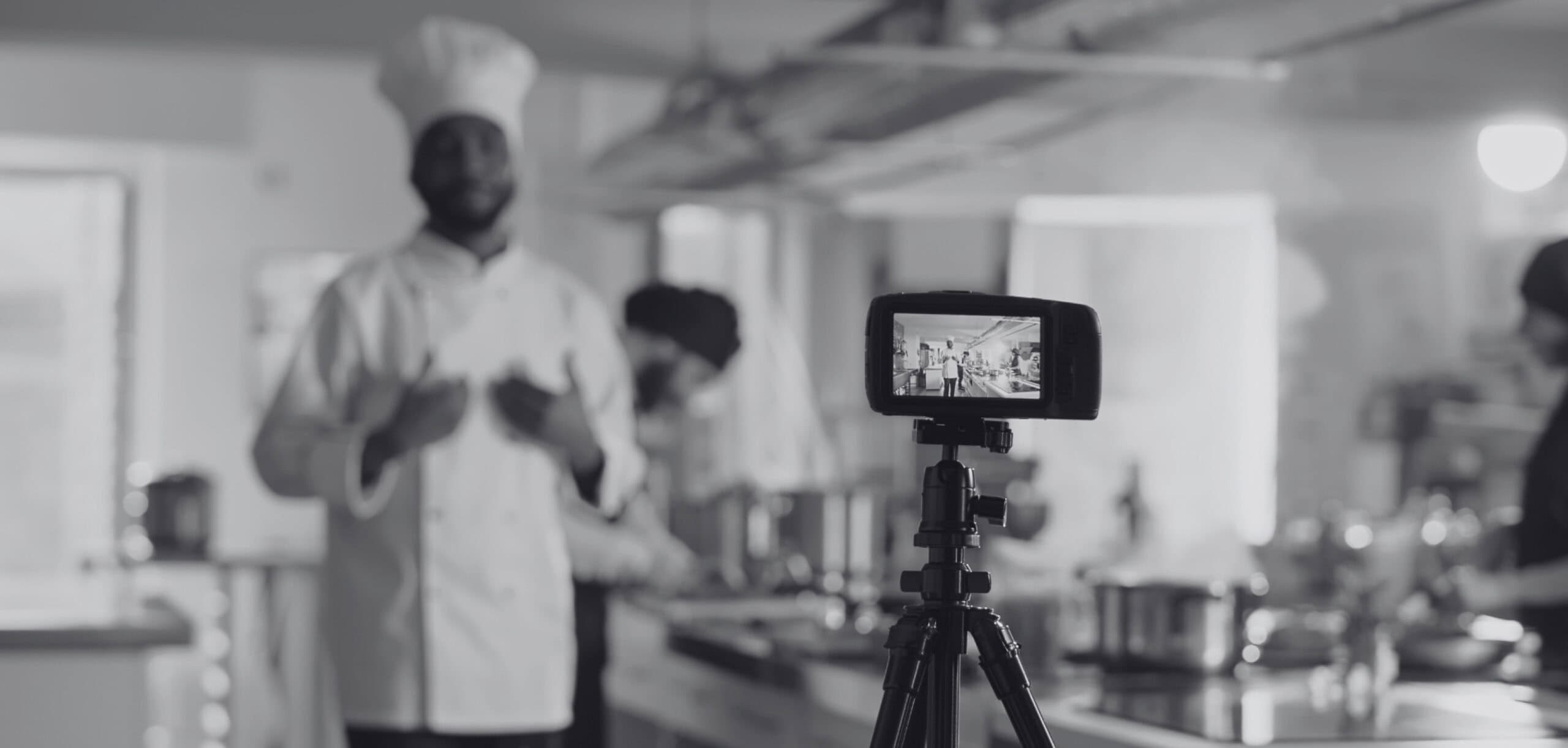 Hospitality marketing consultant filming a hotel chef for a digital campaign