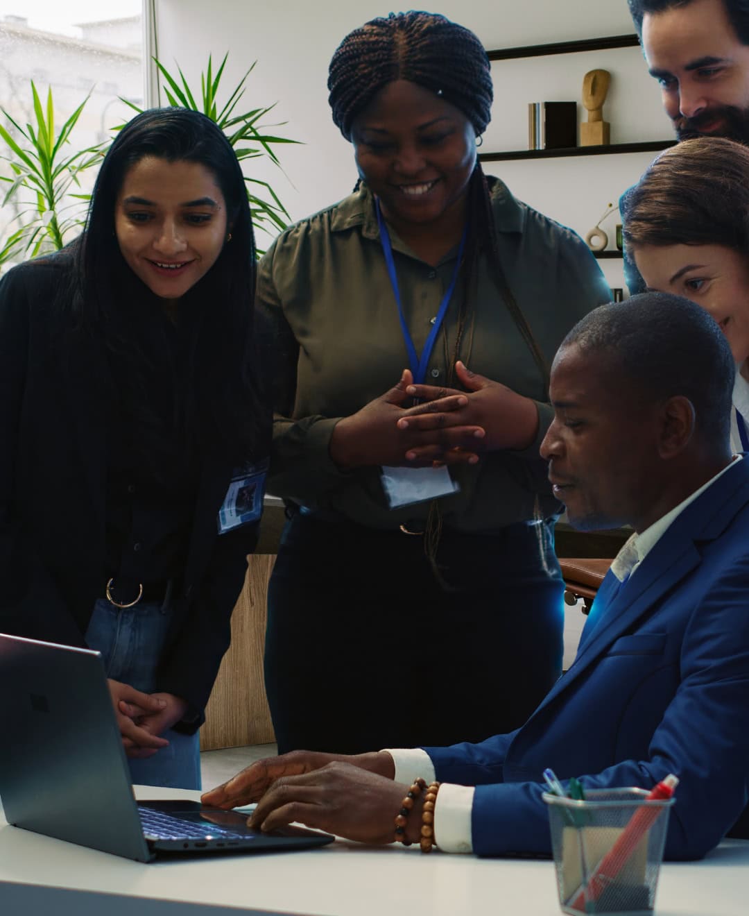 Is Hiring a Consultant Right for Your Business A woman in a business suit shaking hands with a man.